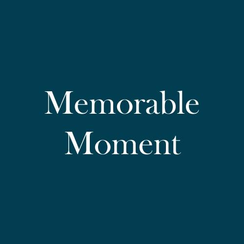 The word "Memorable Moment" is displayed in white, serif, type on a dark green background.