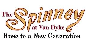 The Spinney at Van Dyke Logo in a yellow and red script font with the word Home to a New Generation below in black