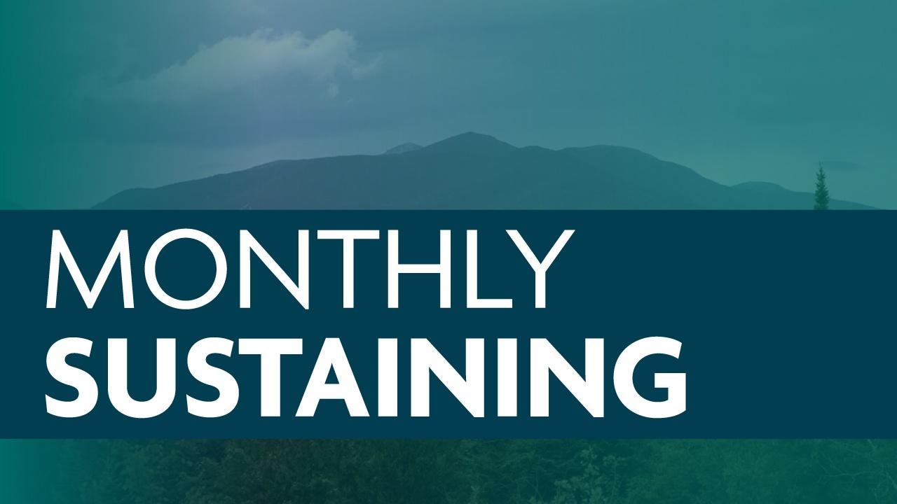 Monthly Sustaining graphic featuring sans-serif type, a green grassy field, and a mountain in the distance.