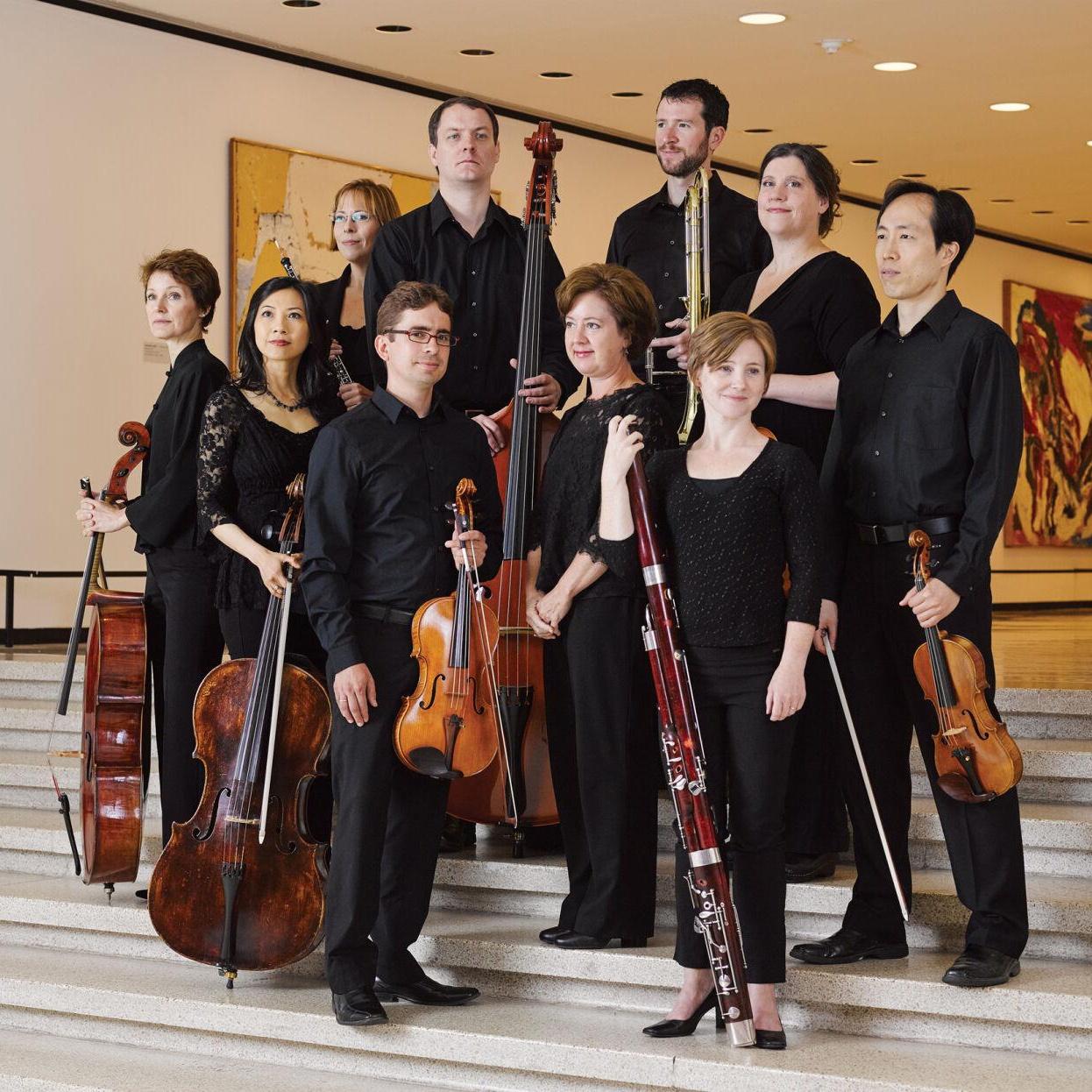Photo of Buffalo Chamber Players with their instruments, dressed in all black
