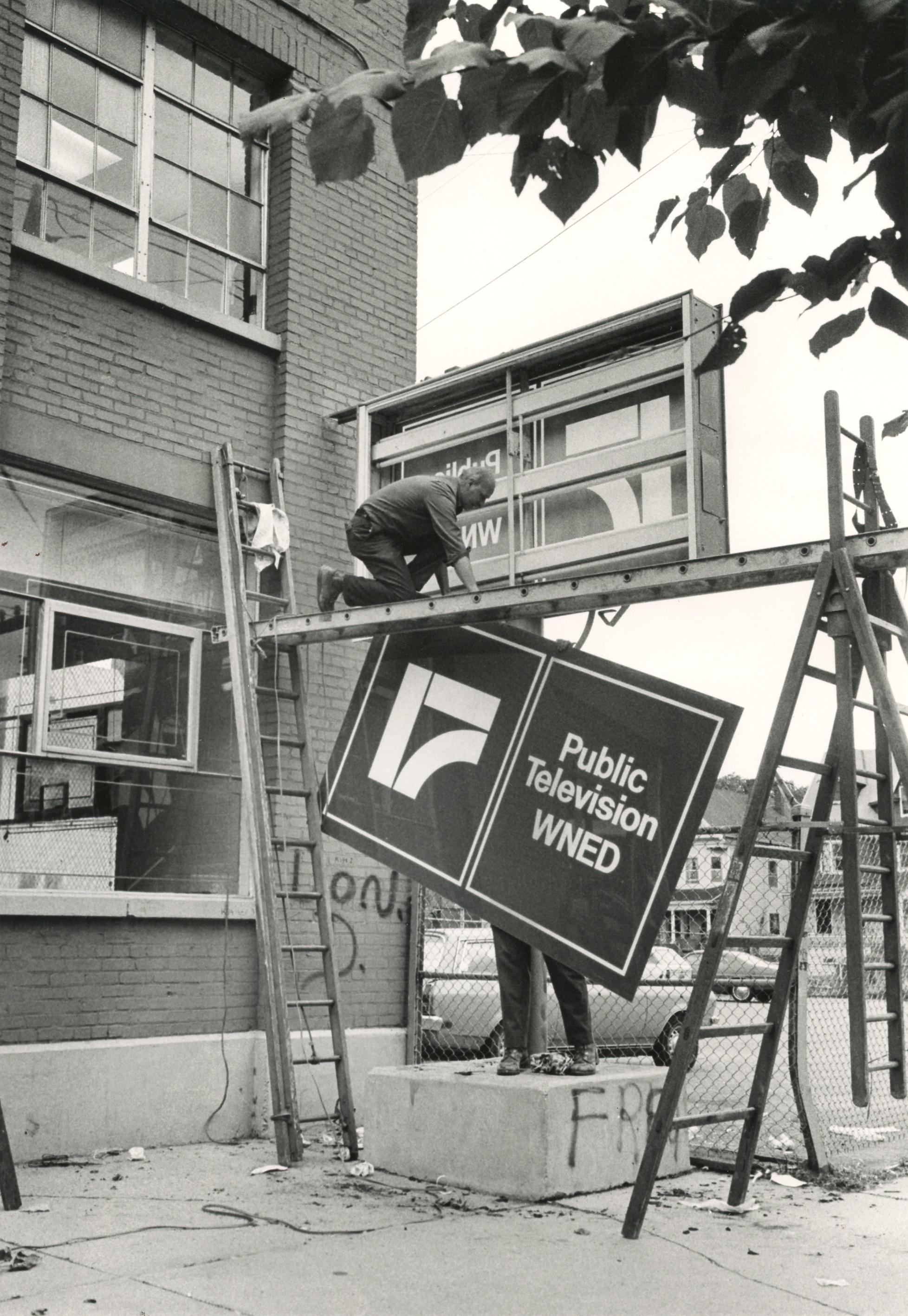 Sign going up at the WNED PBS studio on Barton Street