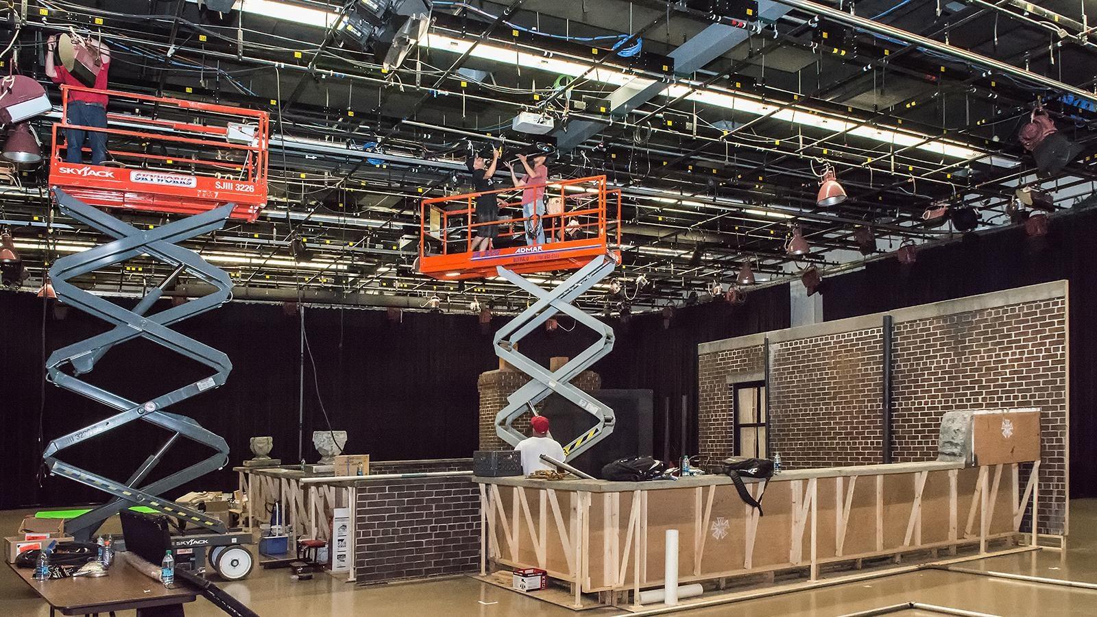 crew hanging lights in Studio One