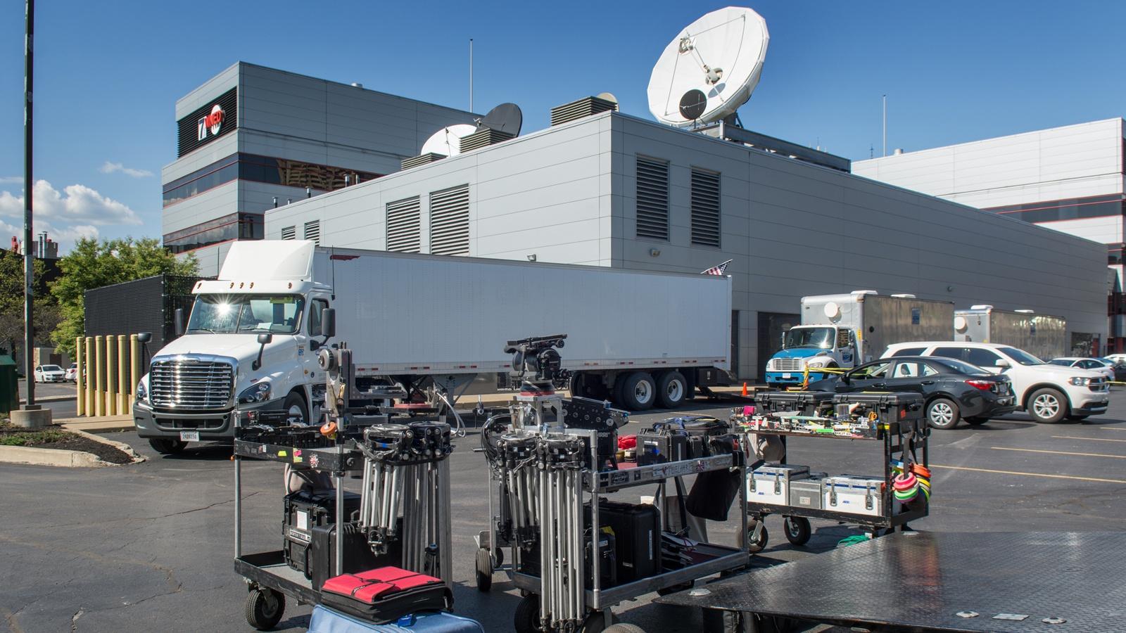 Film trucks in teh WNED | WBFO parking lot during the filming of Marshall