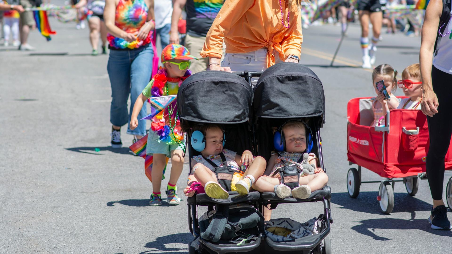 children in strollers in Pride parade