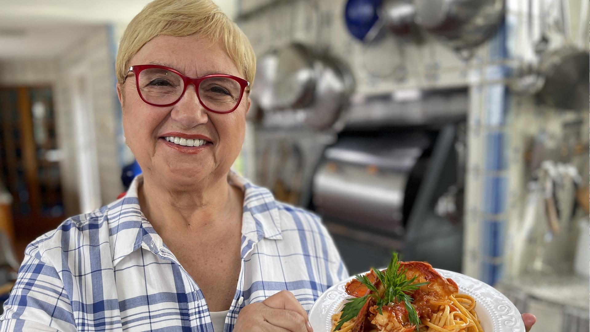 Lidia Bastianich holding plate of pasta