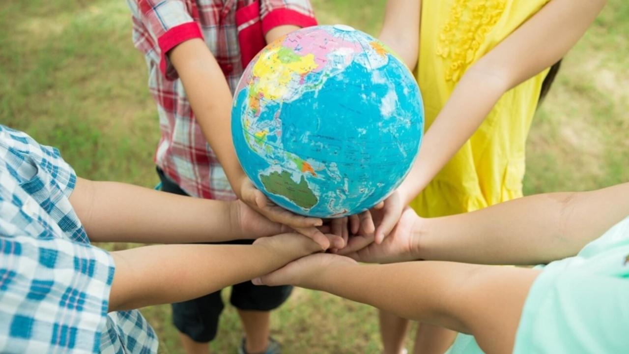 children holding a globe