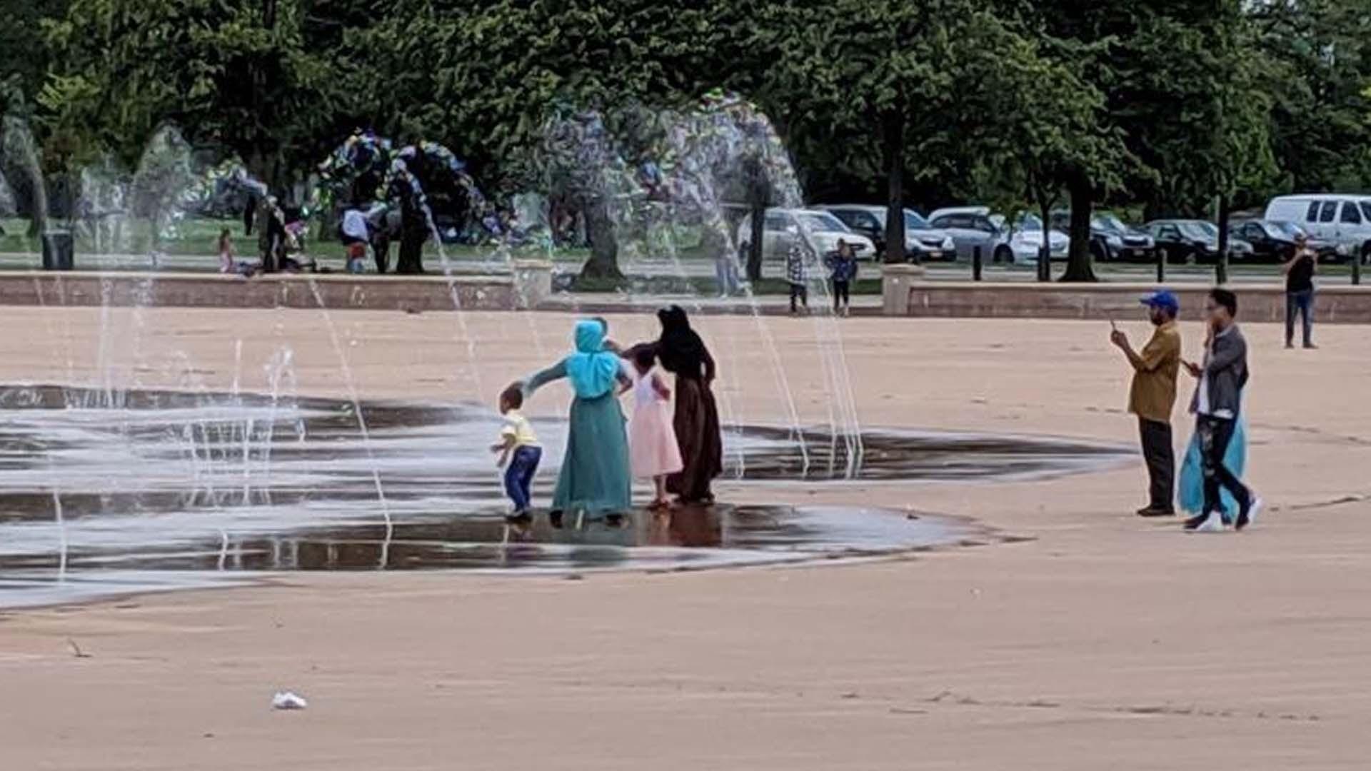 Muslim family enjoying the splash pad at Martin Luther King Jr. Park in Buffalo