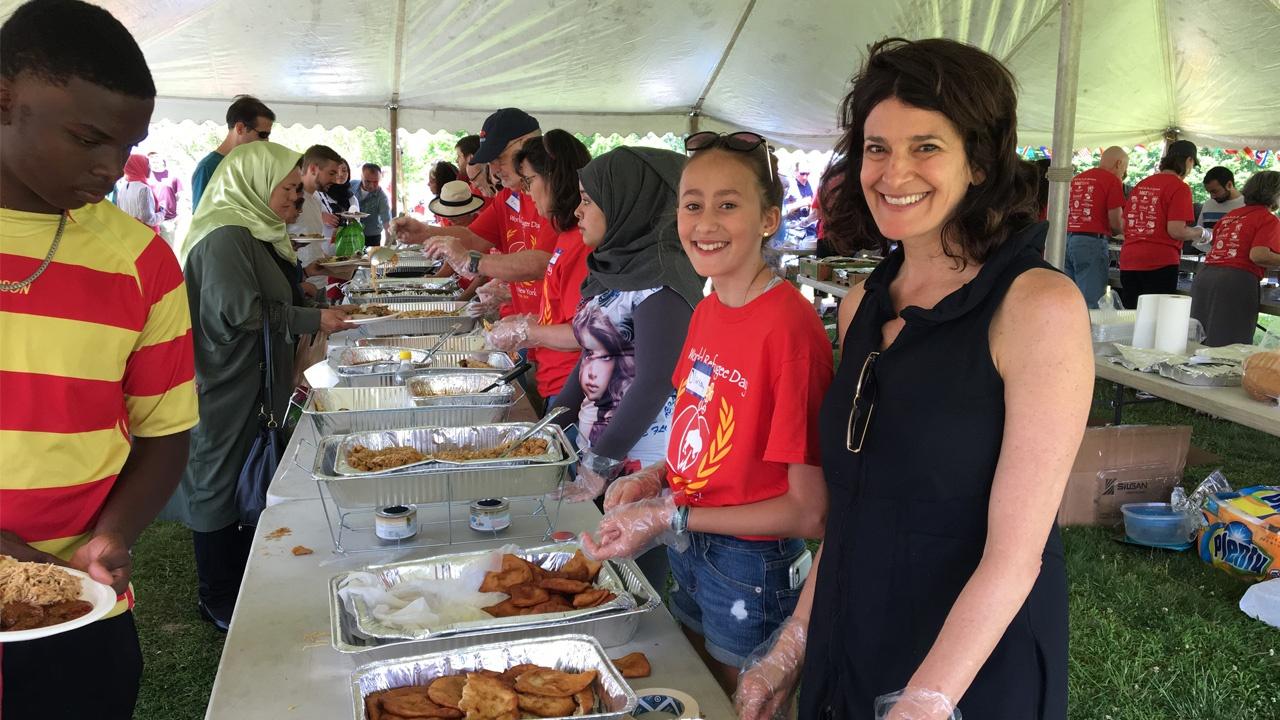 enjoying food at Buffalo's World Refugee Day celebrations