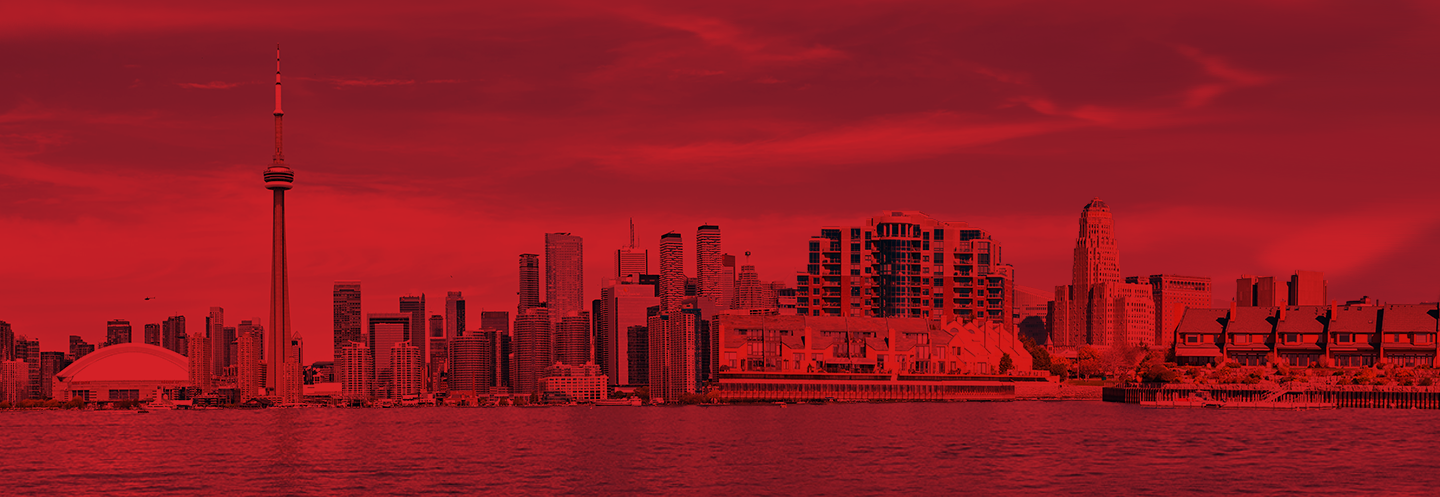 A photo that merges the Buffalo and Toronto skylines with a red filter over it