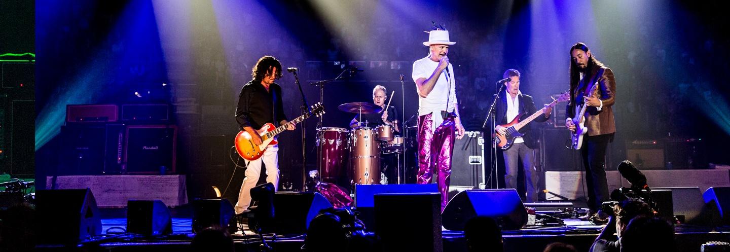 Tragically Hip performing onstage together in 2016