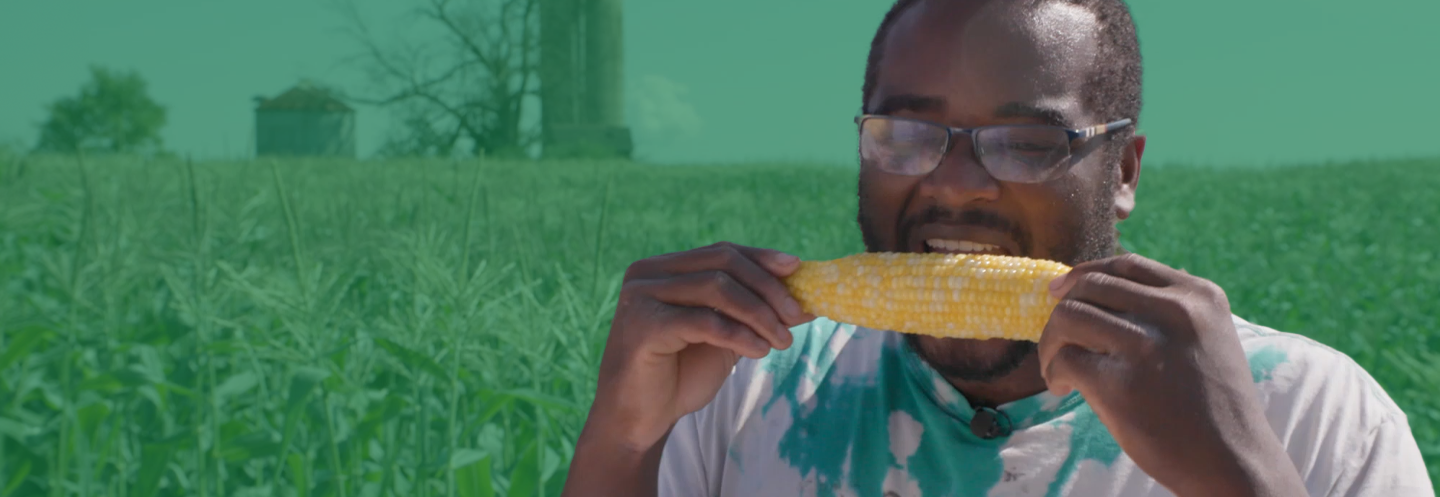 Shane biting into a corn on the cob