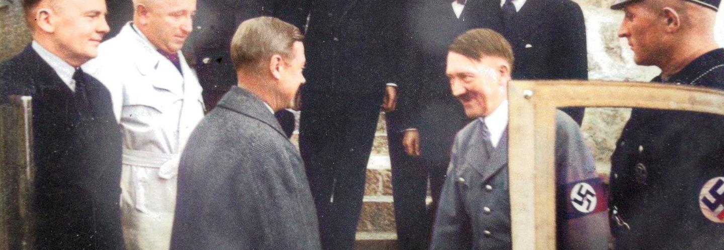 Edward VIII shaking the hand of Adolf Hitler.