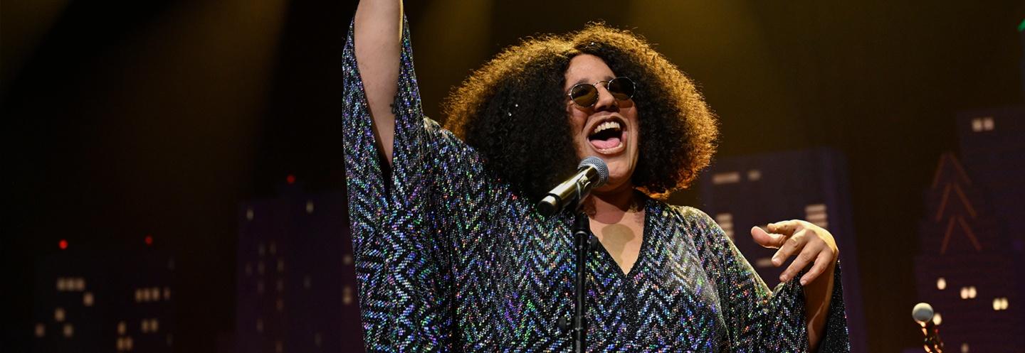 Brittany Howard singing in to a microphone