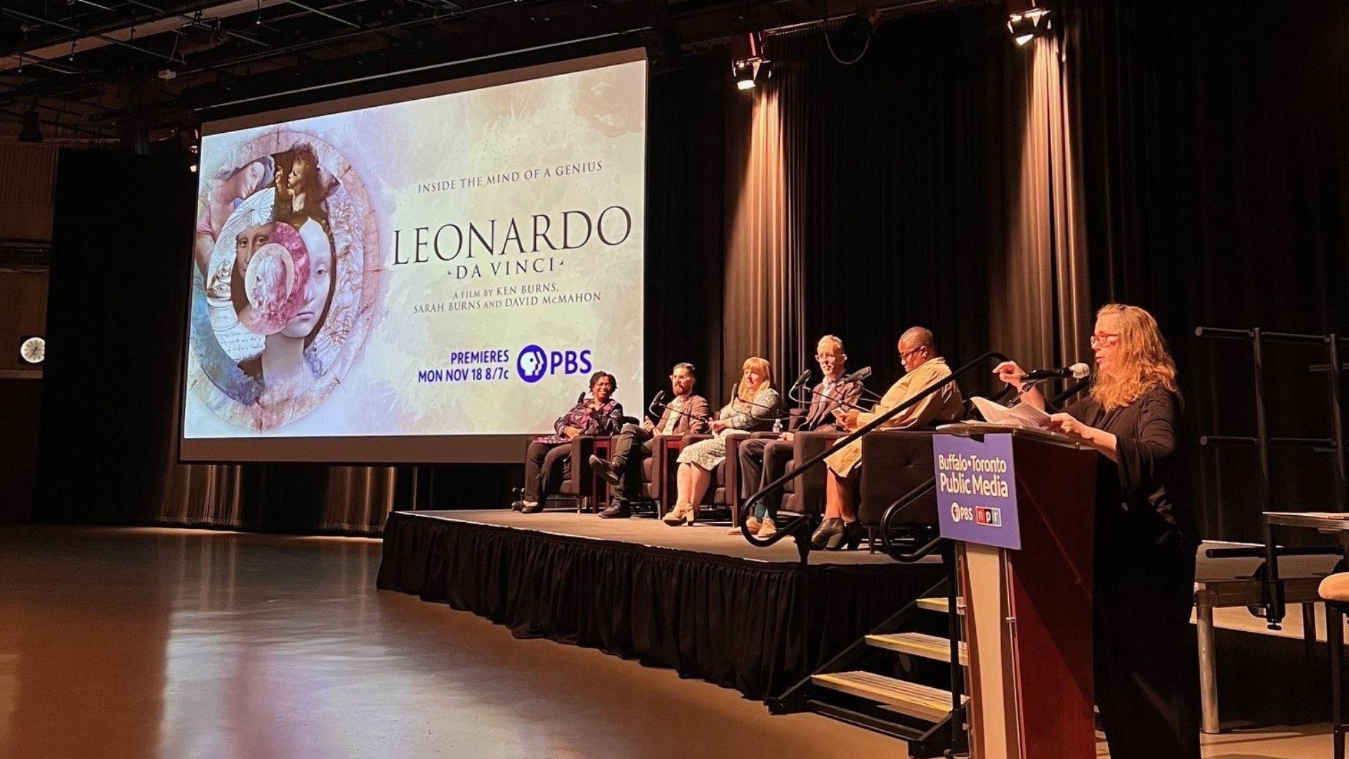 The discussion panel for the LEONARDO screening event sitting onstage and being introduced