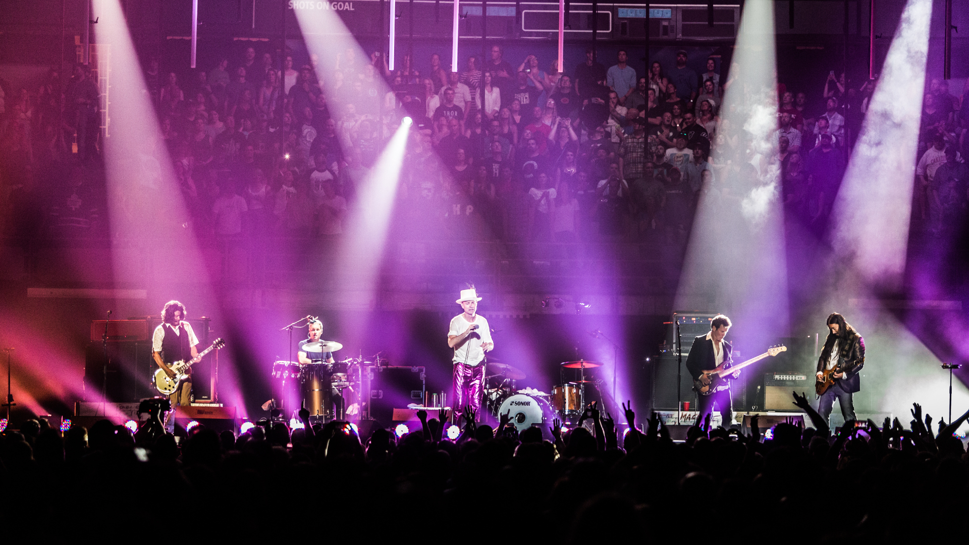 Tragically Hip performing onstage together in 2016