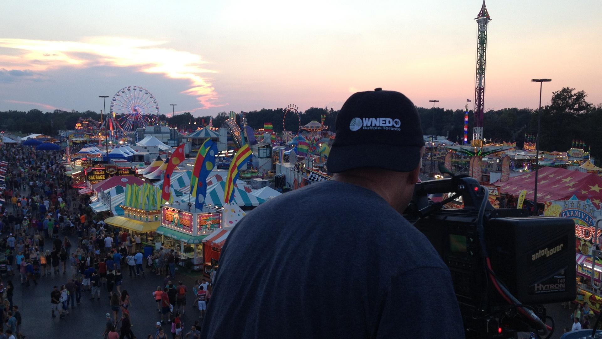 Photographer Jim Zinkowski captures images of the midway at sunset for The Great Erie County Fair