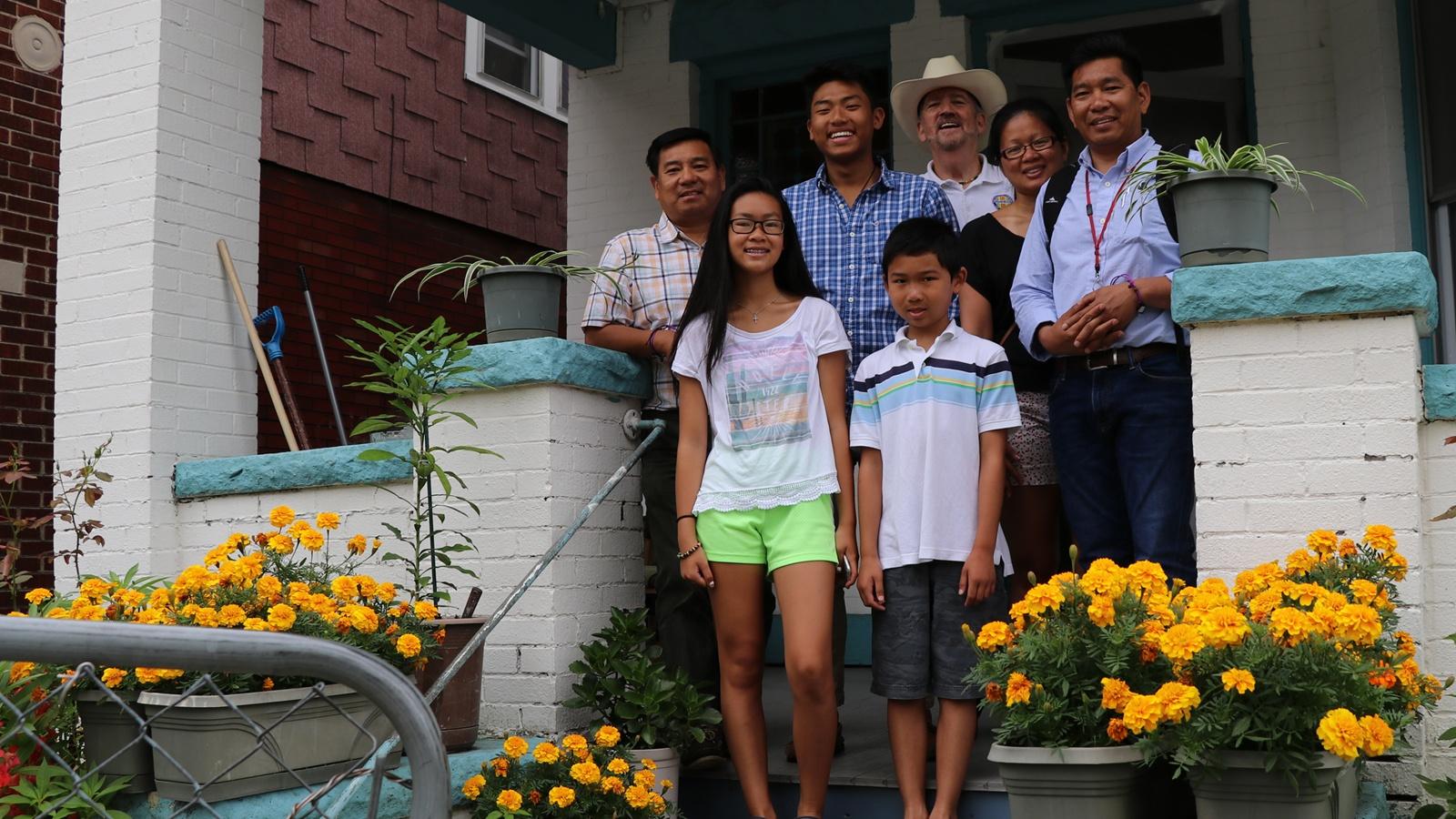 Brothers Minh and Tom Trân, their family, and Vietnam veteran Norm Murray. The Trân family escaped communist Vietnam in the late 1970’s after the Vietnam war.
