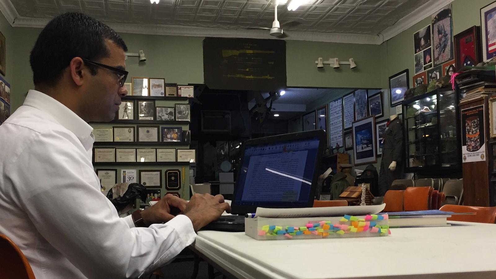 Thomas Chacko reviews data he has collected for more than two years on Vietnam veterans as he prepares a presentation for the local VVA chapter in Western NY.