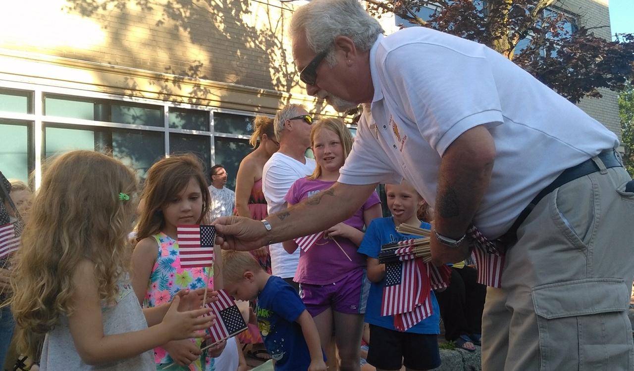 The young parade goers were especially excited to receive an American flag from Chapter 77 Vietnam veterans who passed them out along the route at Canalfest in Tonawanda, New York.