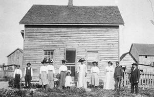 Photograph of Free Black family in front of home in Ontario