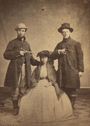 Photo of two owners holding pistols against a slave