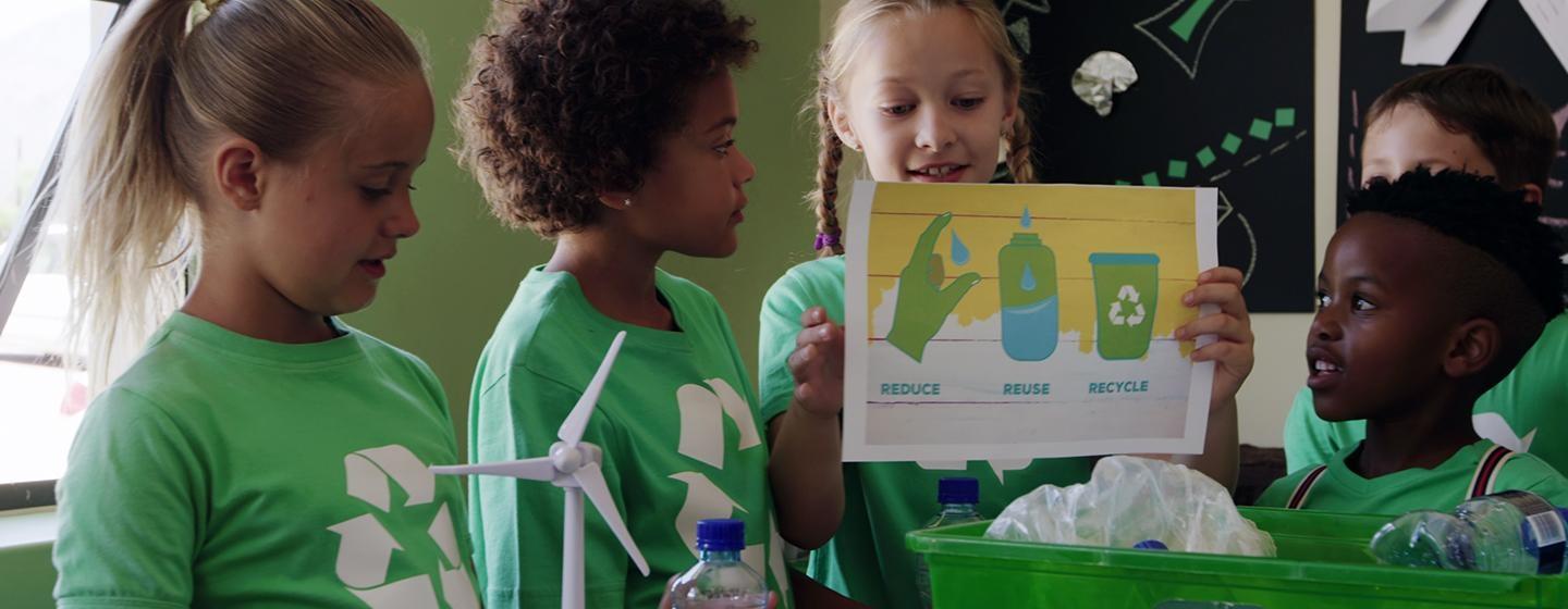 A group of kids learning about recycling