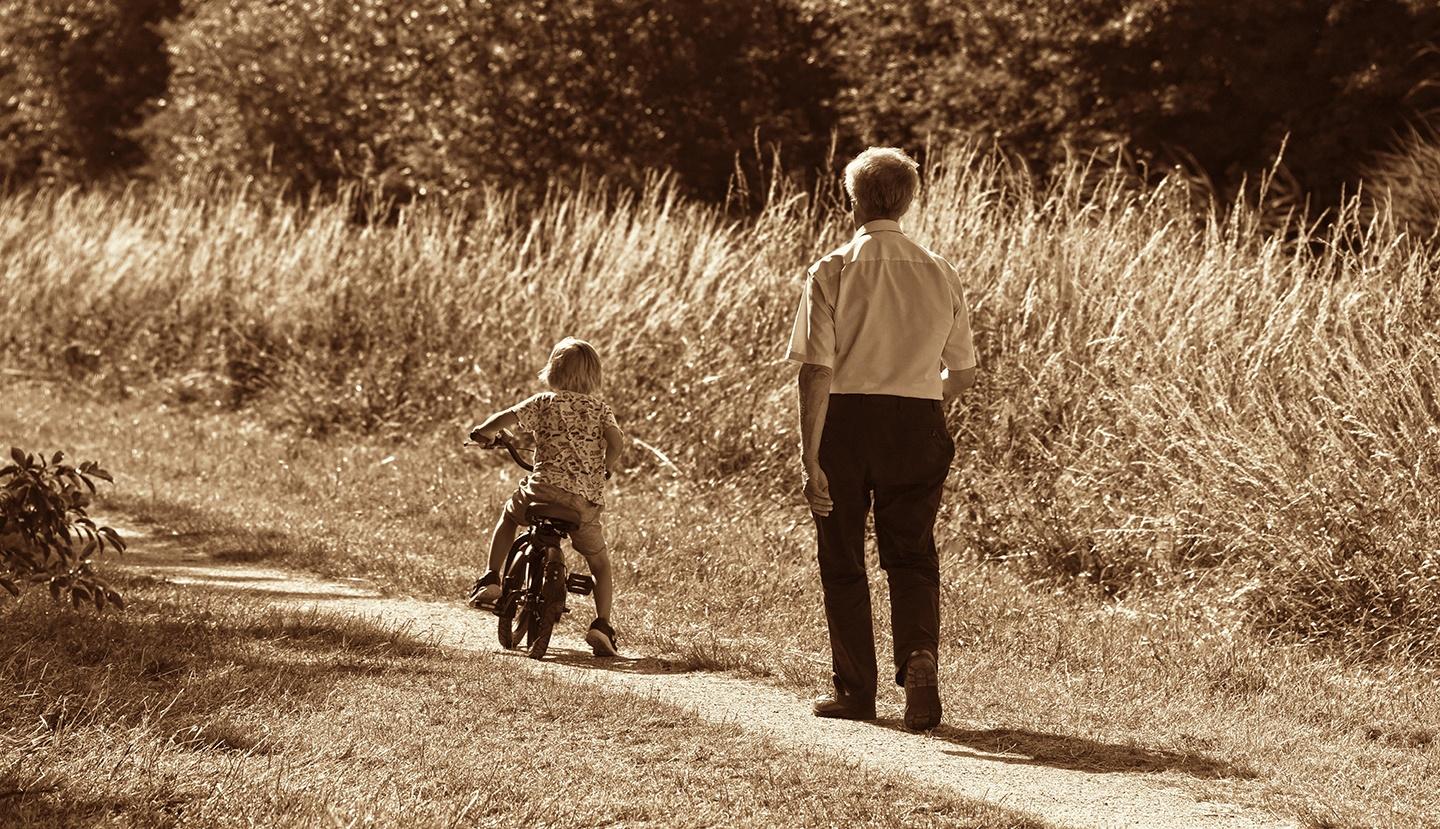 Man and child on a bike