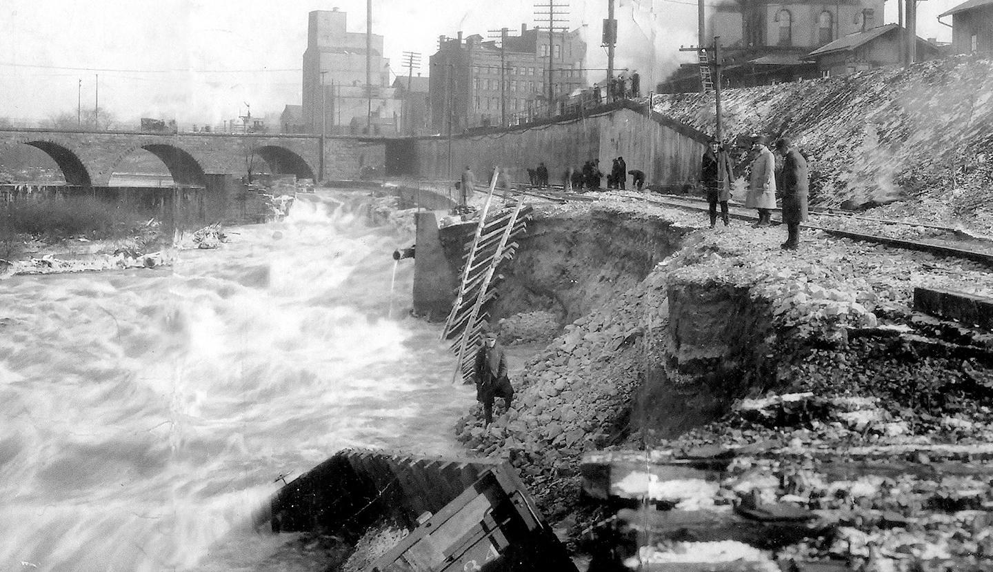 The raging Cuyahoga River in Kent, Ohio destroyed the Pennsylvania & Ohio Canal lock and the adjacent B&O railroad tracks in March 1913.  Photo courtesy of the Kent Historical Society.