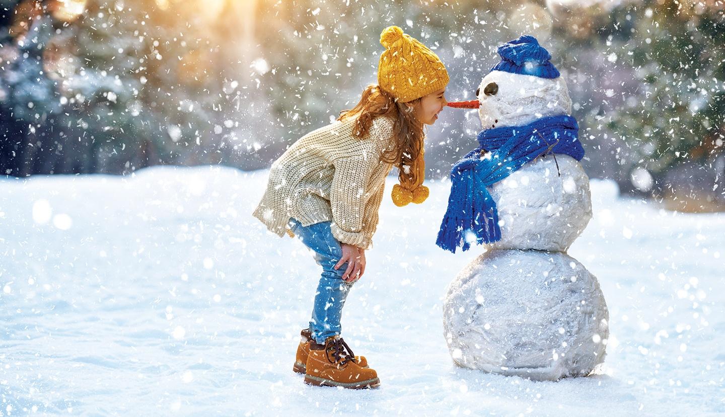 Girl with snowman