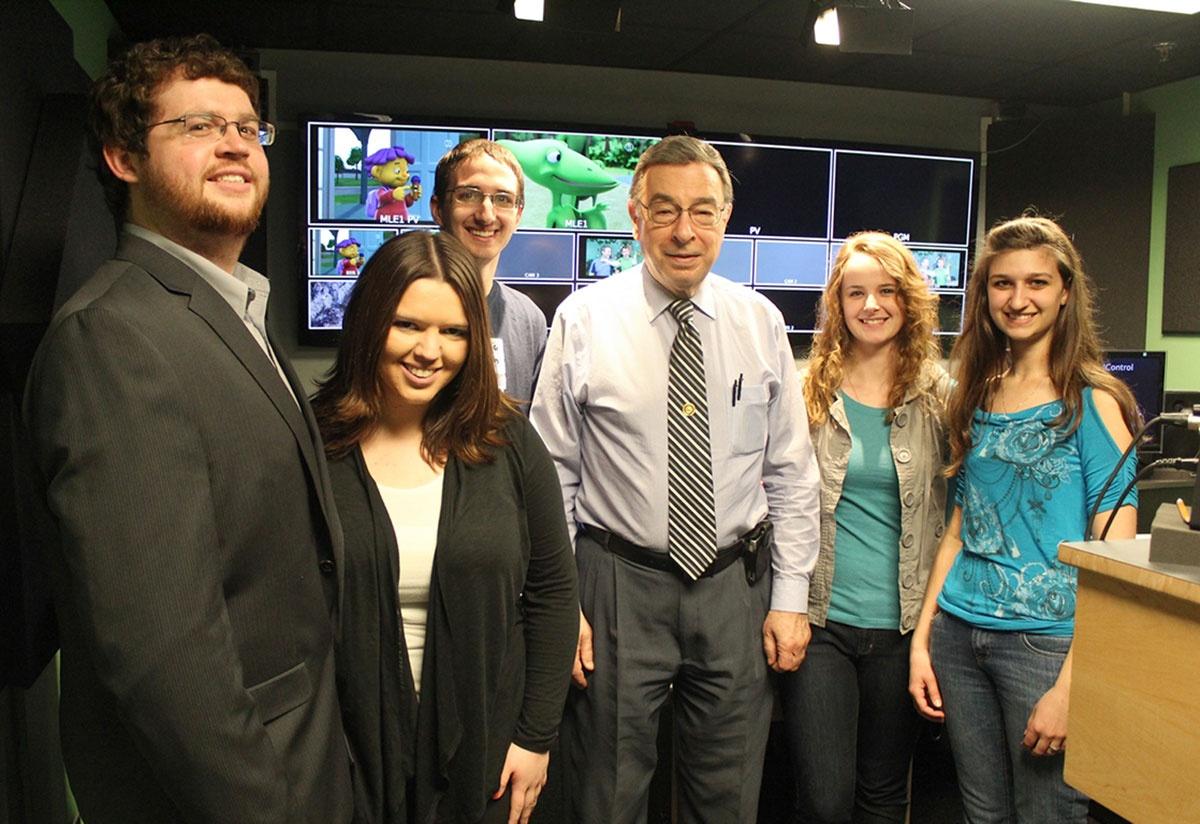 Bruce Turner with students of Public Eye News, the local news program which he was instrumental in starting.