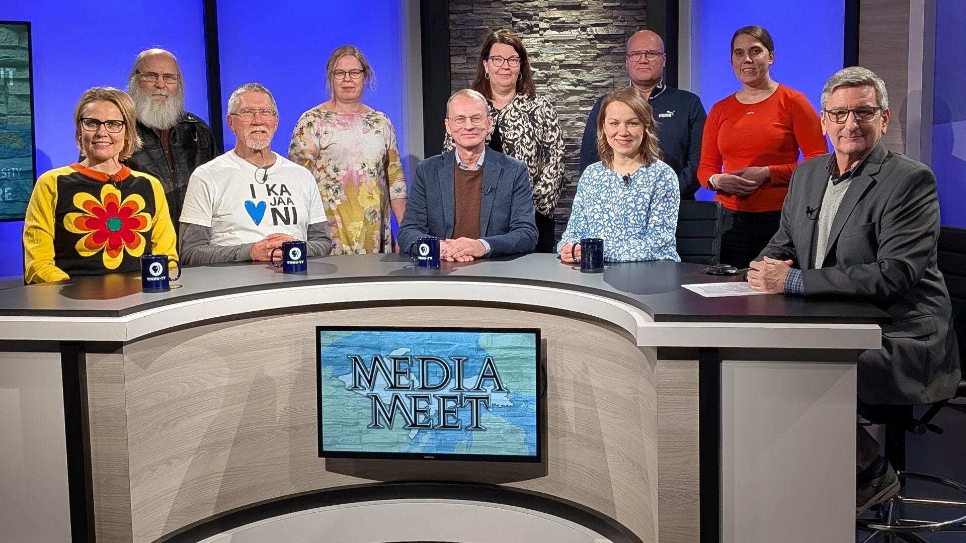 Guests and hosts gather on the WNMU-TV Media Meet set during a local television production.