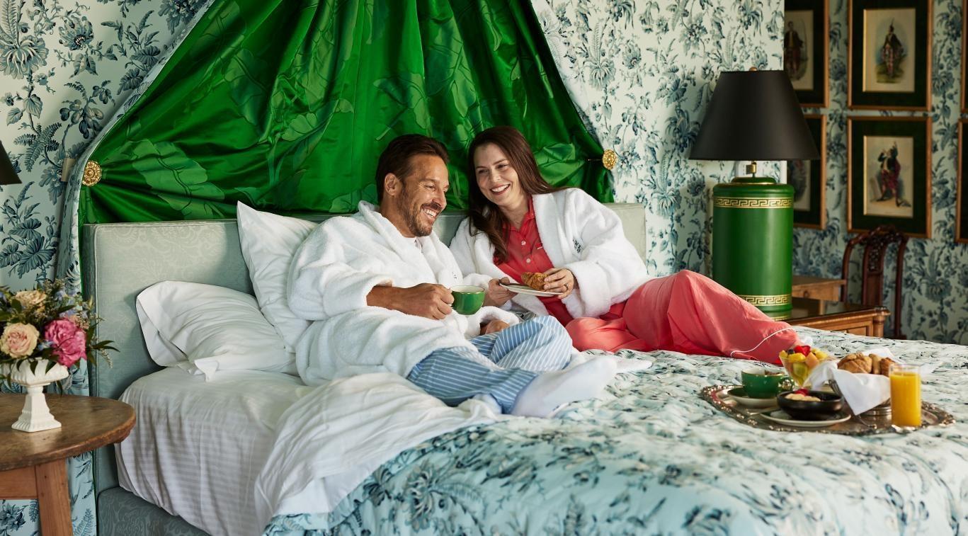 Visitors relaxing in their room at Grand Hotel on Mackinac Island