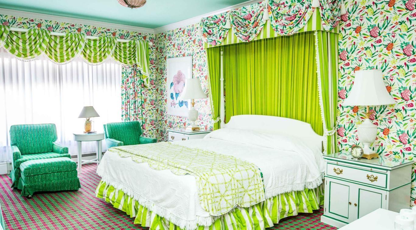 Interior guest room at Grand Hotel with classic decor and large windows