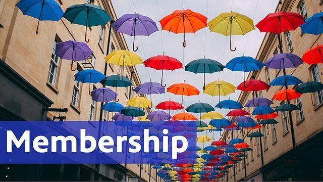 Membership, umbrellas floating between two buildings