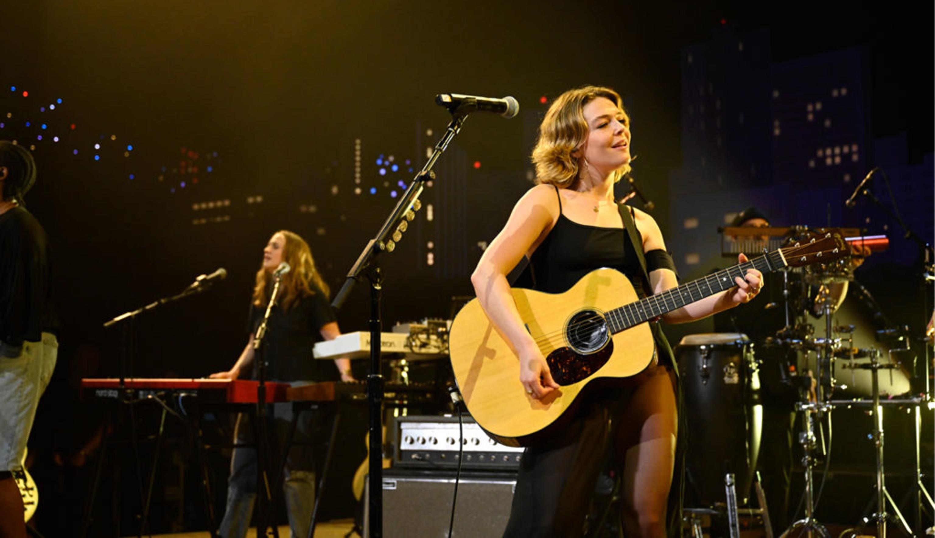 Maggie Rogers and Gracie Abrams on stage performing