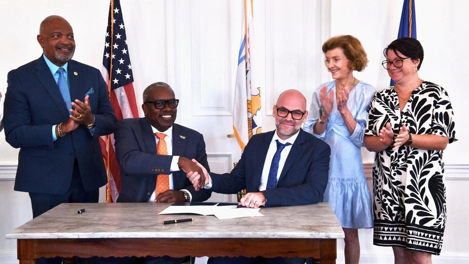 Pictured: Governor Albert Bryan, Jr. shakes hands with St. Barths President Xavier Ledee