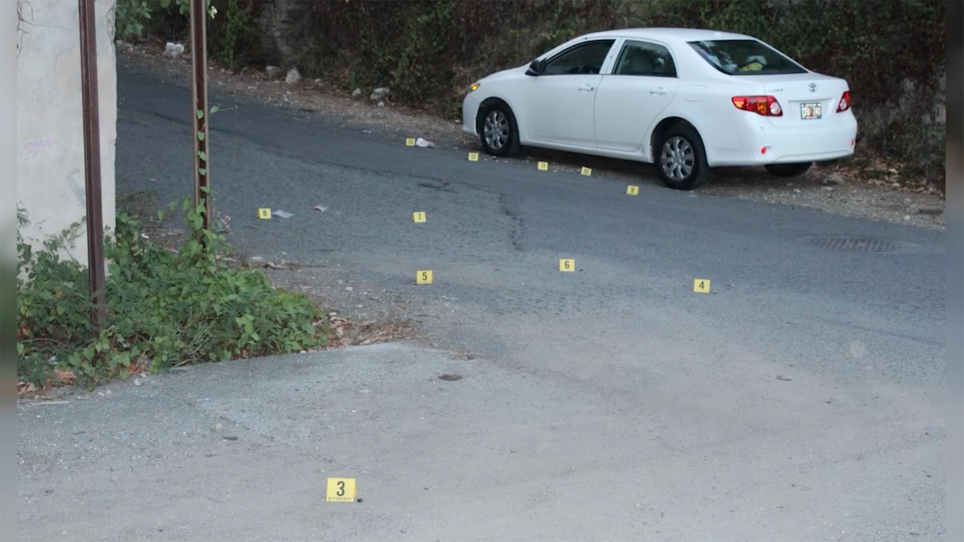 Evidence markers scattered across the intersection 