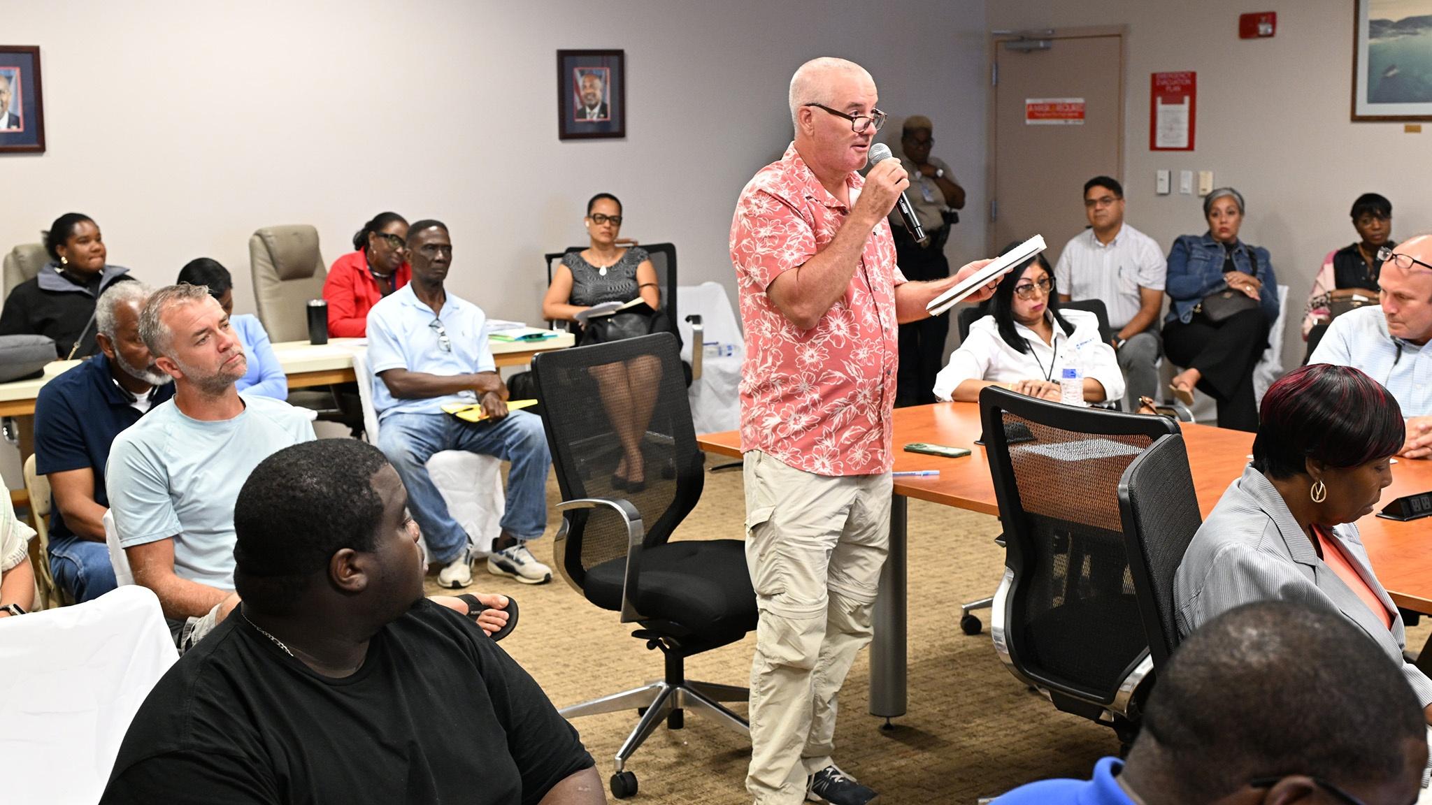 Mike Simpson, Lyric Sails captain, middle, speaks during the Virgin Islands Port Authority’s public hearing on proposed fee increases Wednesday in the VIPA conference room at the Henry E. Rohlsen Airport on St. Croix
