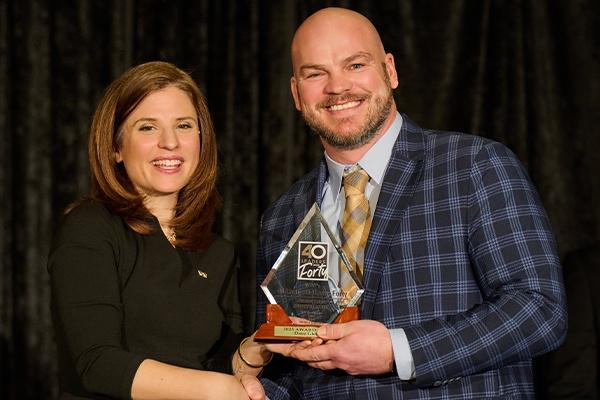 Jenn Gordon presenting Dave Gleissner his 40 Leaders Under Forty Award.