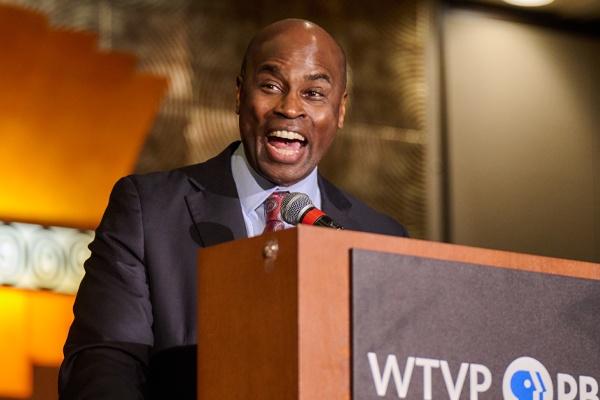 Chris Reynolds, Bradley University, Vice President for Intercollegiate Athletics, giving keynote address at a podium.