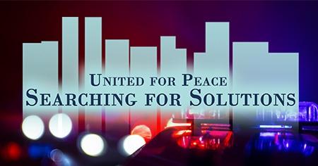 Police car lights in backgrounds. United for Peace: Searching for Solutions