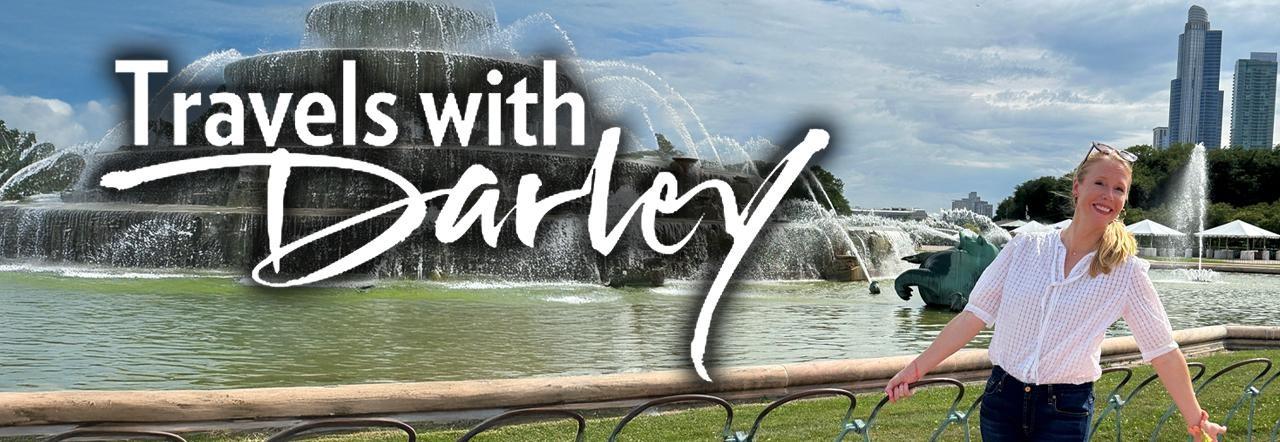 Travels With Darley logo over a photo of Darley at the Buckingham Fountain in Grant Park, Chicago, Illinois