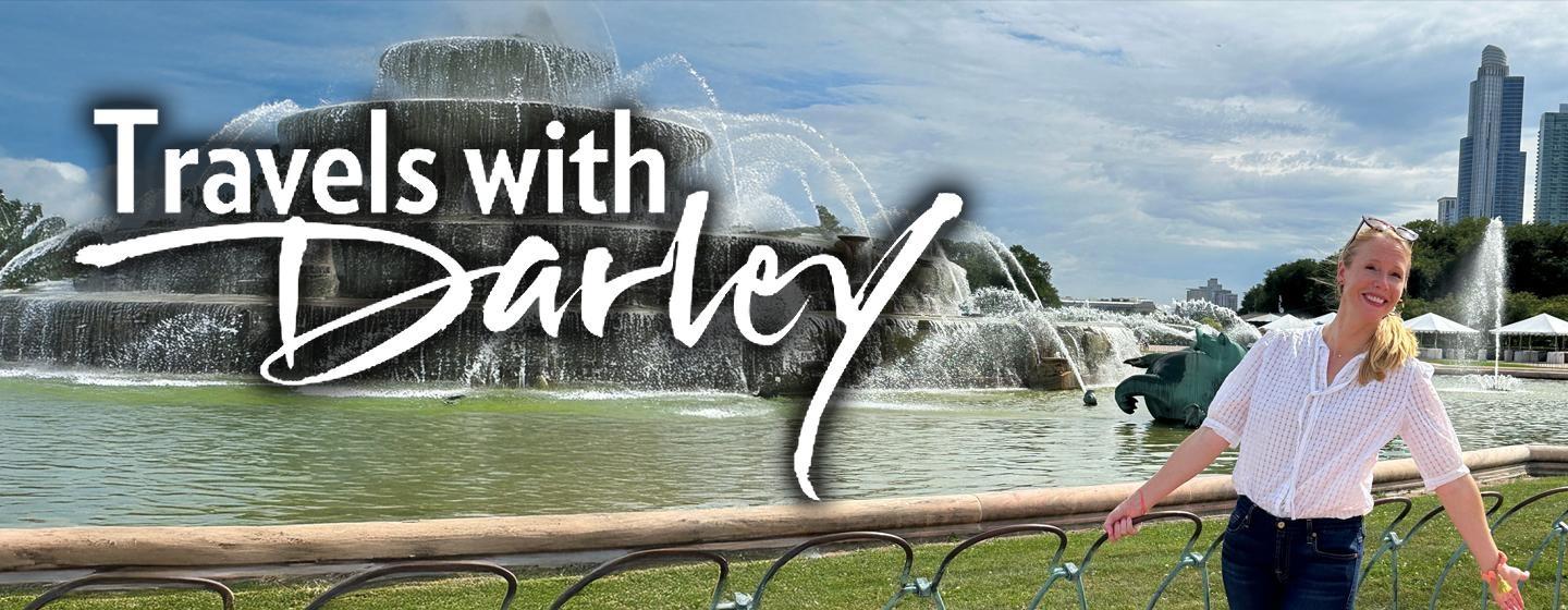 Travels With Darley logo over a photo of Darley at the Buckingham Fountain in Grant Park, Chicago, Illinois