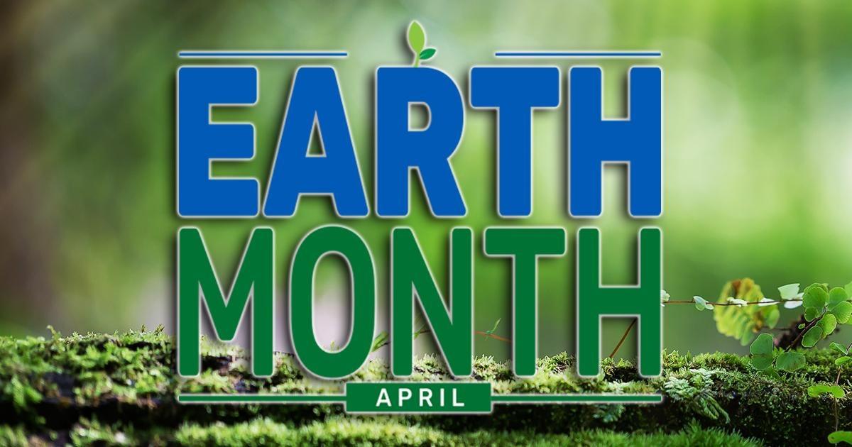 ext: Earth Month | April, over a green blurred background with a moss covered log.