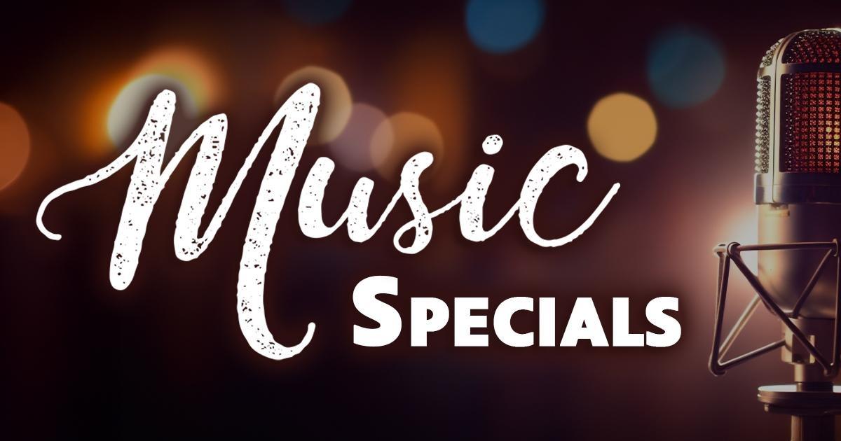 Text: Music Specials, over a background of blurred lights and a microphone in the foreground.
