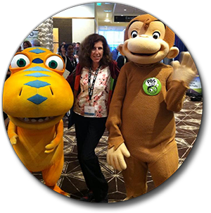 Stacey with Curious George and Buddy the Dinosaur