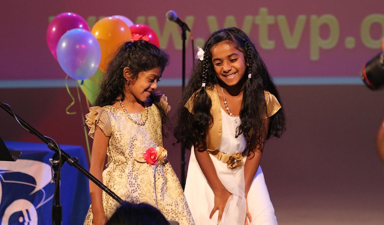 Two 2017 Writers contest winners laughing onstage at event