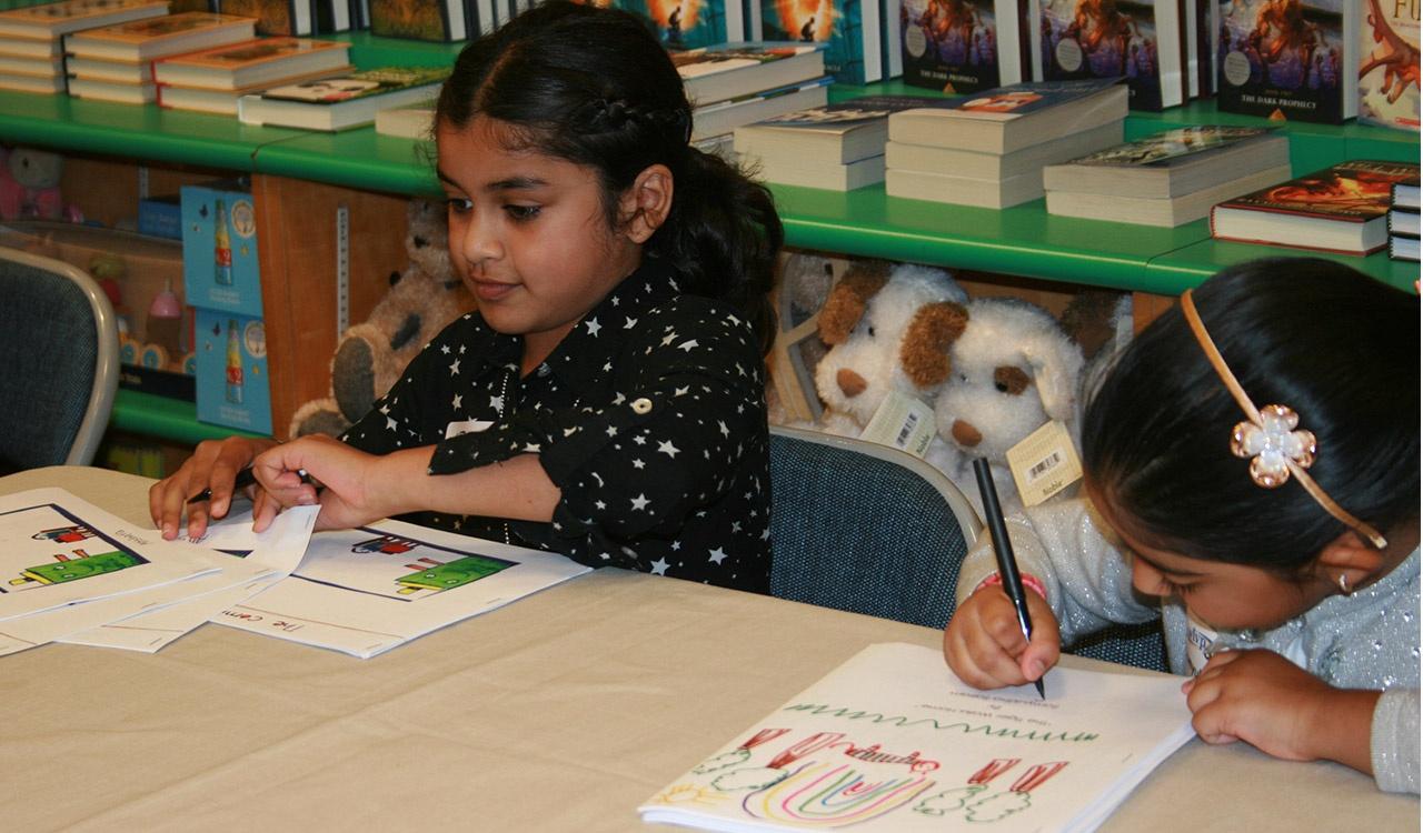 Akshara and Samyuktha signing their books at Barnes and Noble