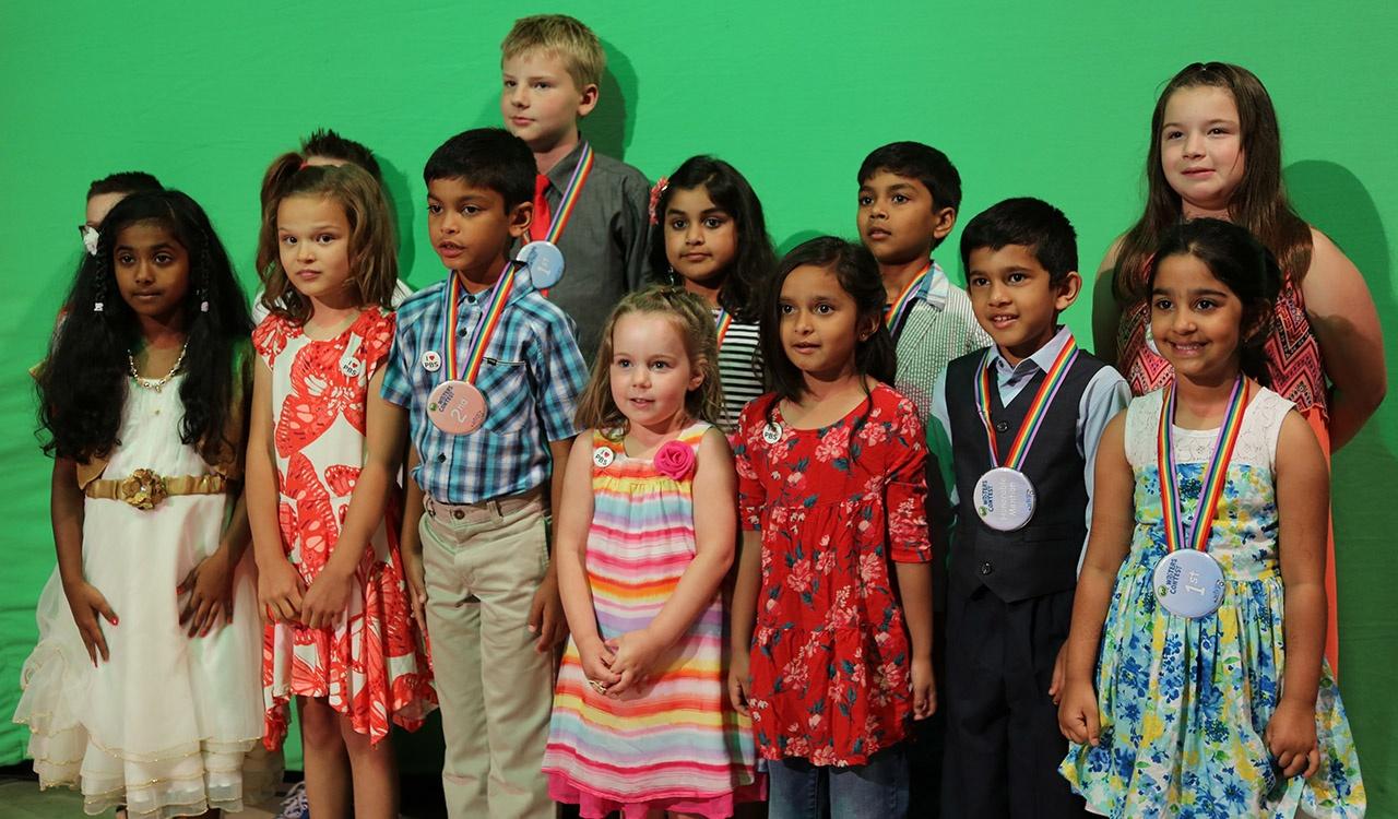 2017 Writers Contest Group Shot in front of Green Screen