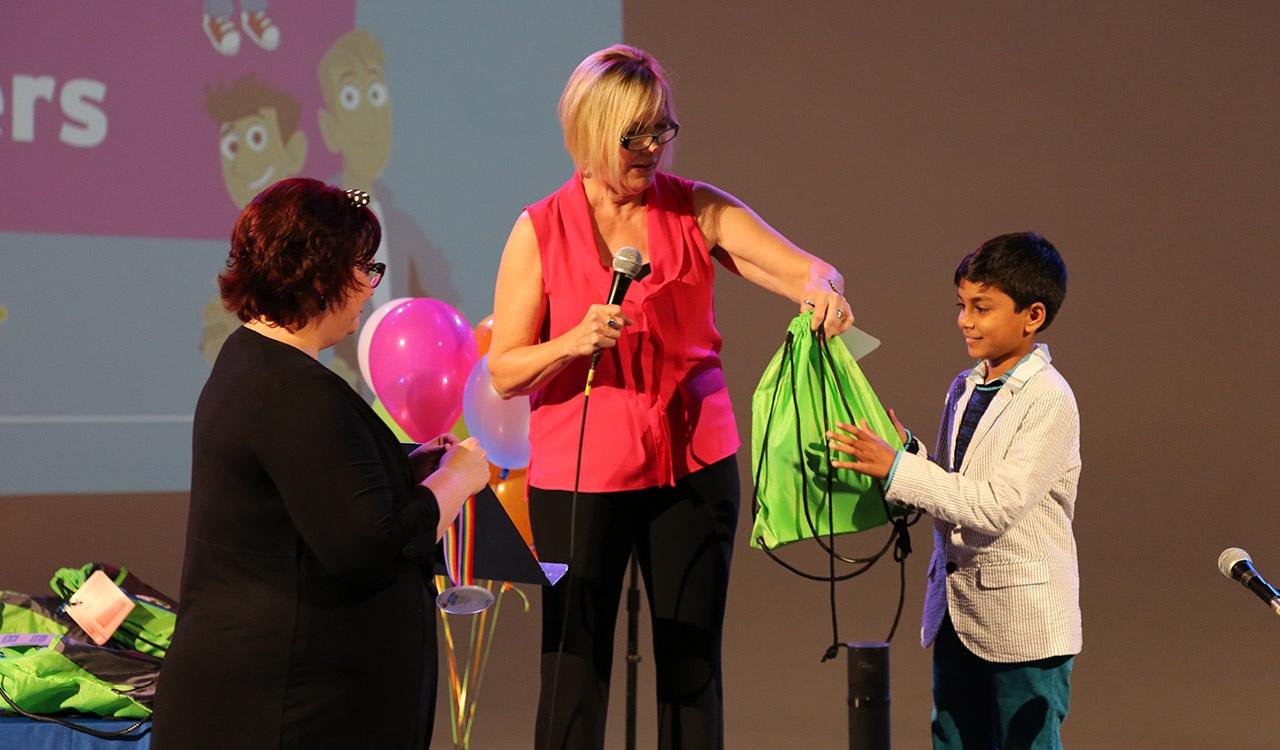 Mary handing prizes to a winner